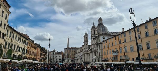 Buildings in city against sky