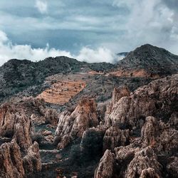 Panoramic view of rocky mountains against sky