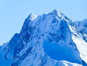 Steep mountain ridge with snow