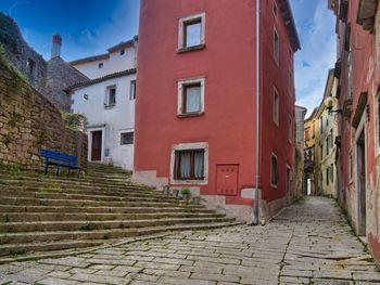 Footpath amidst buildings in town