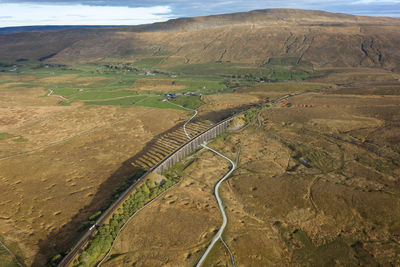 High angle view of road passing through field