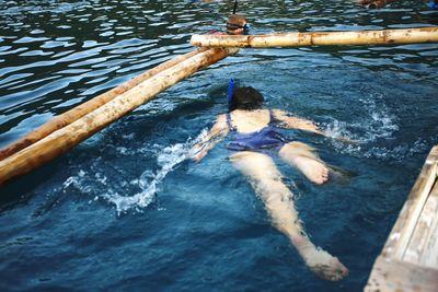 High angle view of man swimming in pool