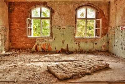 Damaged window in abandoned building