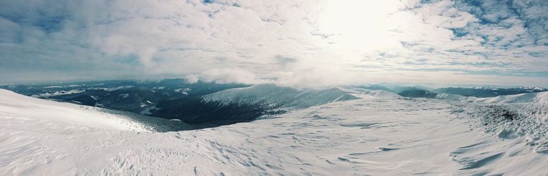 Scenic view of snowcapped mountains against sky