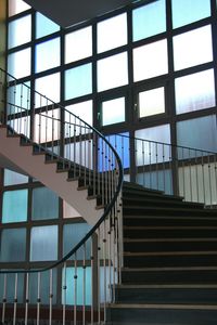 Low angle view of stairs in glass building