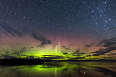 Scenic view of lake against star field at night