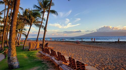 Scenic view of beach against sky during sunset