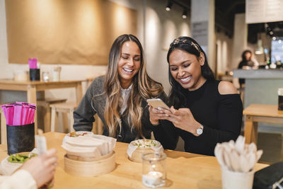 Young woman using smart phone