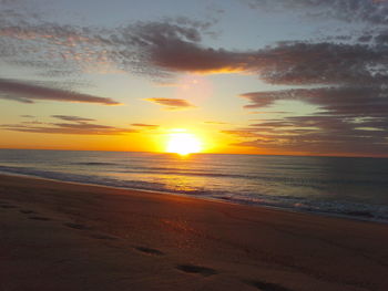 View of calm sea at sunset