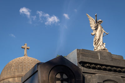 Low angle view of statue against sky