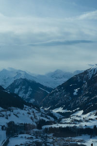 Scenic view of snowcapped mountains against sky