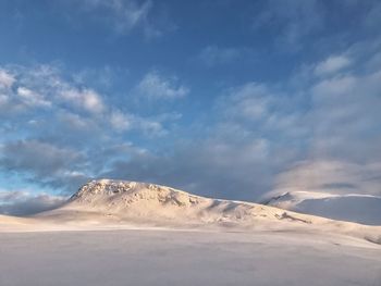 Scenic view of snowcapped mountain against sky