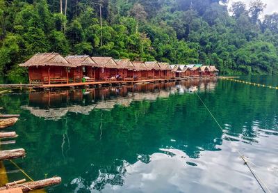 Built structure in lake against trees in forest