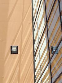 Low angle view of window on wall of building