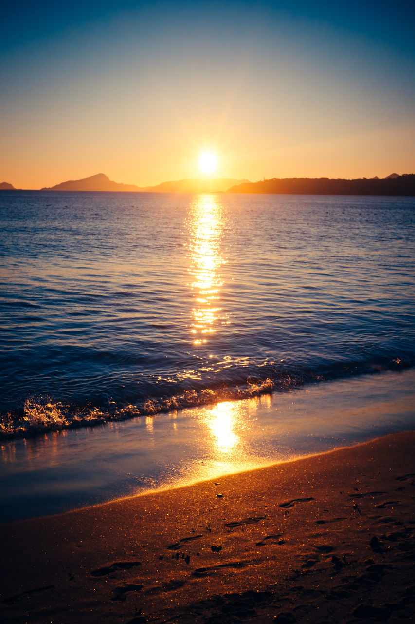 SCENIC VIEW OF SUNSET OVER SEA