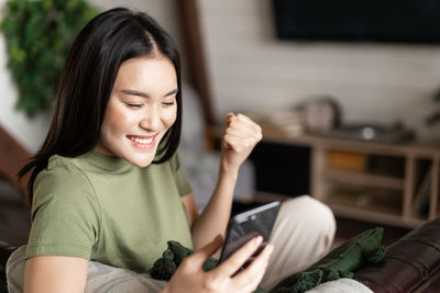 Young woman using mobile phone