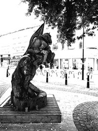 Statue of woman in city