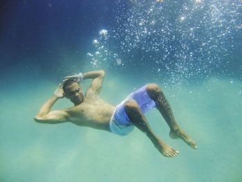 Man swimming in sea