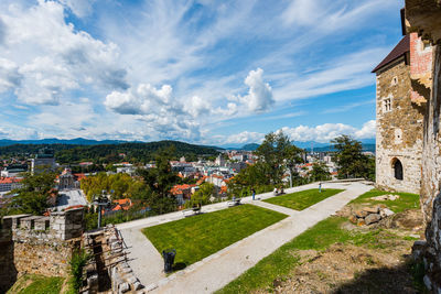 Buildings in town against sky