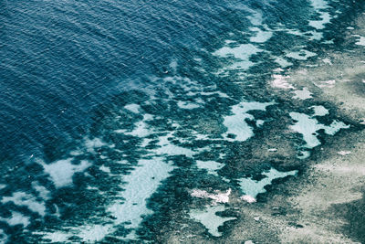 High angle view of snow on sea