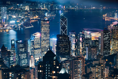 High angle view of illuminated city buildings at night