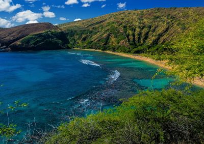 Scenic view of hanauma bay against blue sky