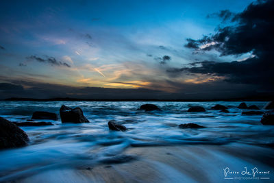 Scenic view of sea at sunset