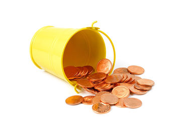 Close-up of coins on white background