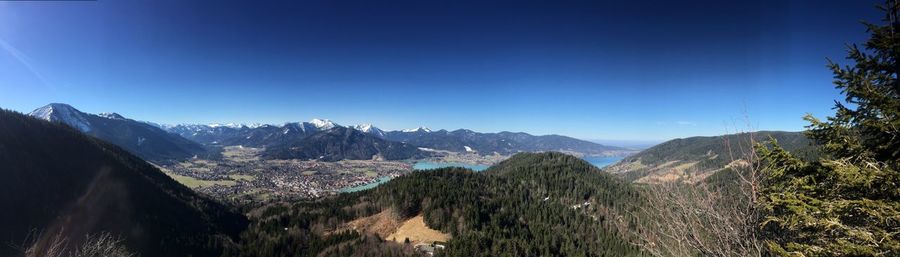 Panoramic view of landscape against clear blue sky