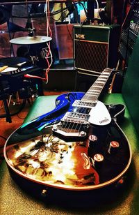 High angle view of guitar on table