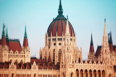 Panoramic view of buildings in city against clear sky