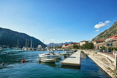 Boats moored at harbor