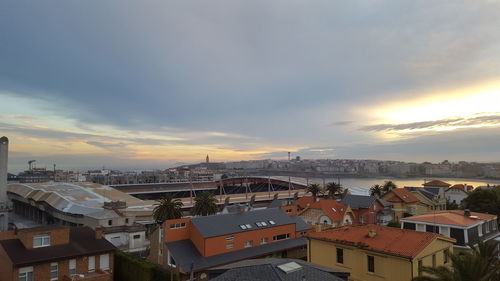 Cityscape against sky during sunset