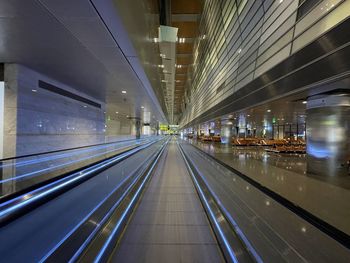 Illuminated railroad station platform at airport