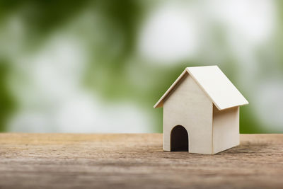 Close-up of toy on house against building