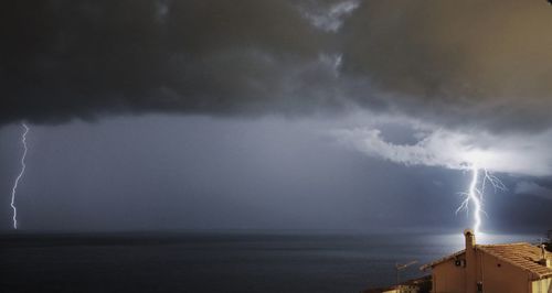 Lightning over sea at dusk