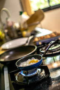 Fried egg in pan on stove