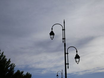 Low angle view of street light against sky