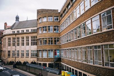 Buildings in city against sky