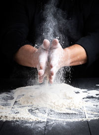 Midsection of chef preparing food