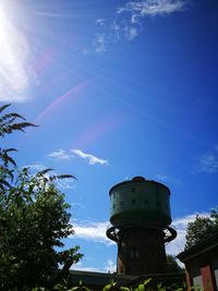 Low angle view of tower against blue sky