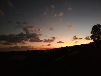 Scenic view of silhouette landscape against sky during sunset