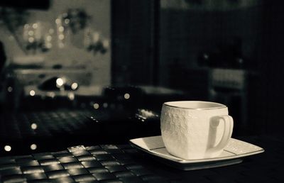 Close-up of coffee cup on table