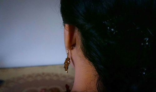 Close-up portrait of a young woman looking away