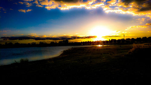 View of calm lake at sunset