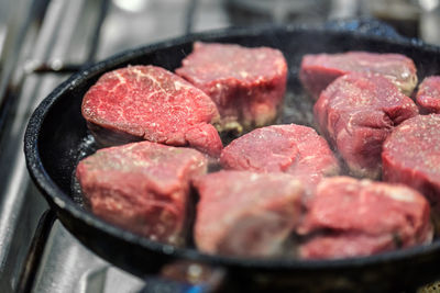 Close-up of meat in cooking pan