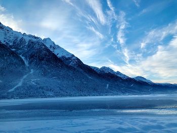 Scenic view of snowcapped mountains against sky