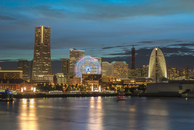 Night panorama of the cosmo clock 21 big wheel at cosmo world theme park in japan.