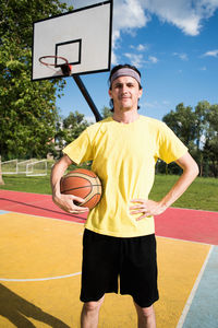 Portrait of man with basketball