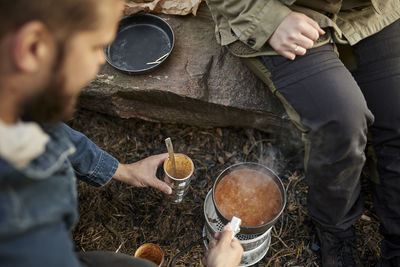 Midsection of man preparing food